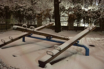Snowy Playground Seesaw in the city