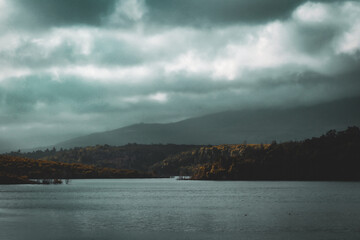 Wind stirs the lake under a dark sky