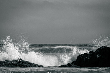 Waves crash over rocks in the ocean