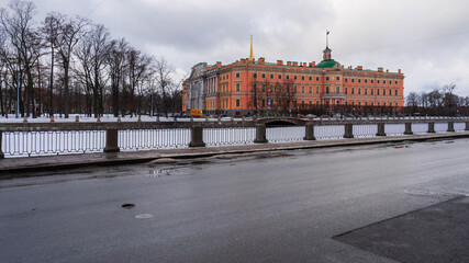 Fototapeta na wymiar St. Petersburg, Russia, February 4, 2024. River embankment and view of Mikhailovsky Castle in winter.