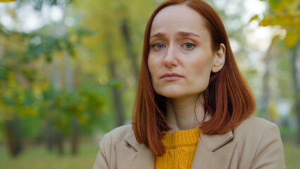 Close up portrait female sad face unwell ill sick allergy seasonal flu upset Caucasian woman girl...