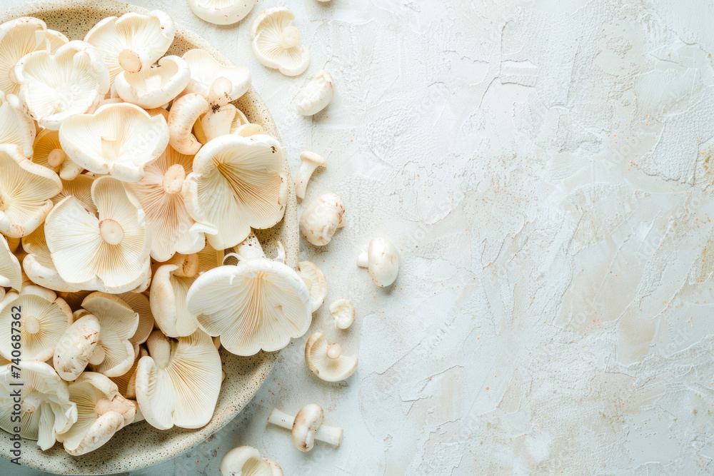 Wall mural Fresh champignon mushrooms on white.