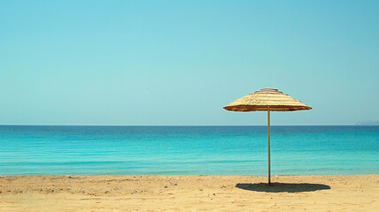 Tropical beach with umbrella, empty beach without people