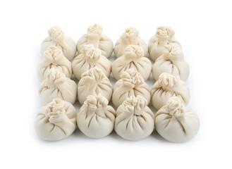 Uncooked khinkali (dumplings) isolated on white. Georgian cuisine