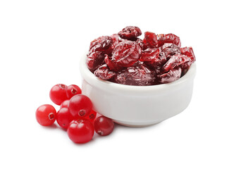 Dried cranberries in bowl and fresh berries on white background