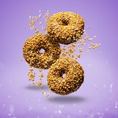 Flying Chocolate Donuts Sprinkled With Crunchy Peanut Purple