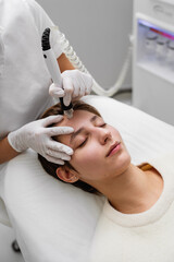 Treatment of women's facial skin in a beauty salon.
