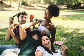 Friends Enjoying Watermelon in the Park