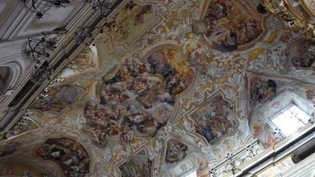 Gimbal footage of beautiful frescoes, decorating the ceiling of the impressive San Benedetto church in Catania, Italy
