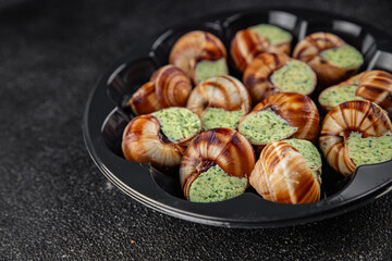 snails with green oil aromatic herbs tasty fresh healthy eating cooking appetizer meal food snack on the table copy space food background