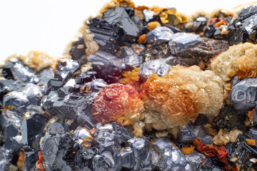 A raw cluster of pyrite, galena, limonite, calcite and sphalerite isolated on a white background surface macro. A variety of crystallised sulfide, hydroxide, iron and silicate minerals in matrix.