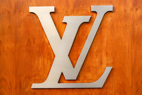 Paris france  june   : Louis Vuitton vitrine logo on wooden background