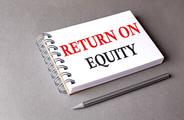 RETURN ON EQUITY word on notebook on grey background