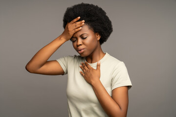 Sick african american woman touch head, having high temperature, migraine. Unwell black female with...