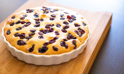 delicious pear and cranberry desserts close-up on wooden board 