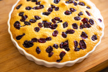 delicious pear and cranberry desserts close-up on wooden board 