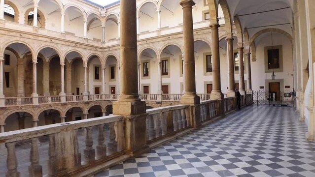 Walking through arches inside Norman Castle in Palermo, history and architecture Sicily Italy
