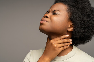African american woman suffering from sore throat, swallowing discomfort, voice loss. Sick female...