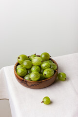Gooseberry in a wooden bowl