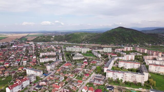 Ukrainian touristic city Mukachevo aerial view with a huge hill at background