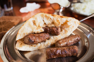 Bosnian Cevapi – the National Dish of Bosnia and Herzegovina made with minced beef and lamb and i...