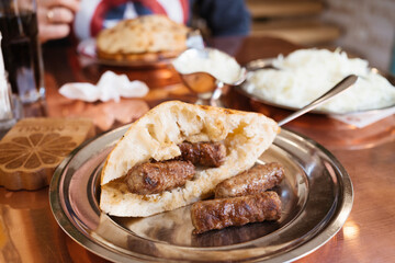 Bosnian Cevapi – the National Dish of Bosnia and Herzegovina made with minced beef and lamb and i...