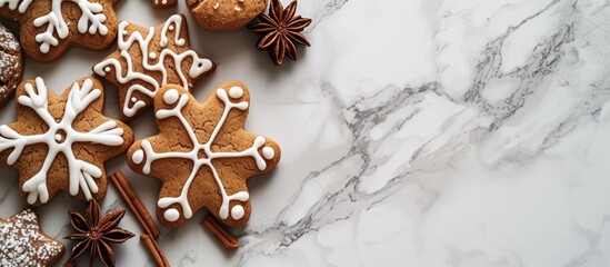 There are several varieties of gingerbread cookies displayed on the table, each decorated with intricate patterns resembling insects, plants, and wood twigs