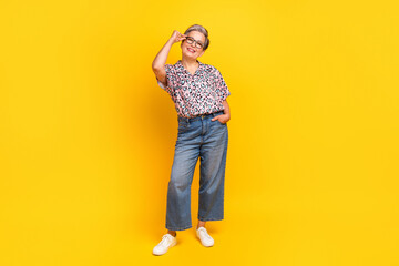 Full length photo of lovely senior lady specs hands jeans pockets dressed stylish leopard print...