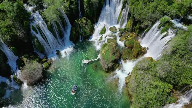 Aerial view of Kravica Waterfall in Bosnia and Herzegovina. The Kravica waterfall is a pearl of the Herzegovinian landscape. It is a unique natural beauty in the Trebizat River. Oasis in stone. 