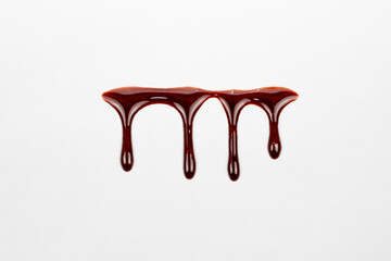 A blood spatter. A blood flowing down. Bloody pattern. Concepts of blood can be used in design