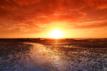 Low tide and sunset on Hauteville-sur-Mer beach.Cotentin coast