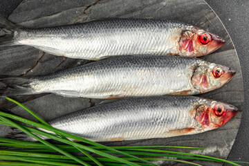 herring fish fresh seafood tasty eating cooking meal food snack on the table copy space food background rustic top view 