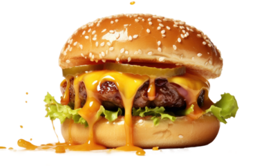Hamburger With Cheese and Lettuce. A close up photo of a hamburger with a juicy beef patty topped with melted cheese and crisp lettuce, served on a sesame seed bun.