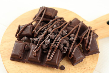 Various Chocolate on Wooden Board