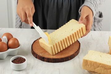 Spreading Butter Margarin on Roti Bakar Bandung Bread