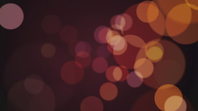 Retro bokeh spheres background in warm vintage brown, beige and orange colors. Full HD and looping light effect abstract motion background animation.