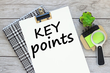 KEY POINTS text on white A4 paper on a beautiful notepad. sticker magnifying glass