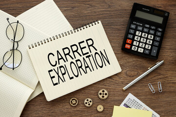 Career Exploration an open notepad on a work table. near a six-wheeler and a calculator