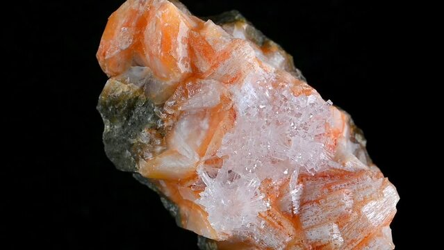 Clear Natrolite crystals on Orange Gmelinite (Glenarm, N. Ireland)
