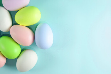 Colorful Easter eggs on green colored background copy space stock photo