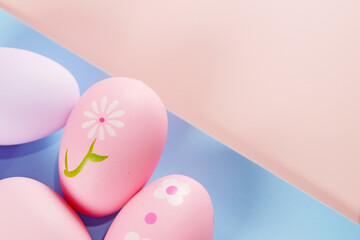 Colorful Easter Eggs on pink colored background copy space stock photo