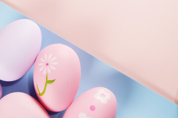 Colorful Easter Eggs on pink colored background copy space stock photo