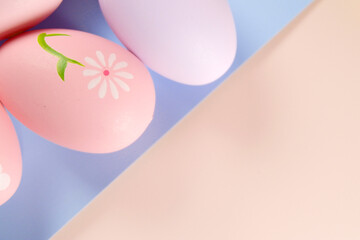 Colorful Easter Eggs on pink colored background copy space stock photo