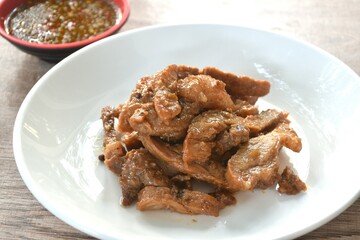 steamed slice sweet pork on plate dipping spicy chili sauce