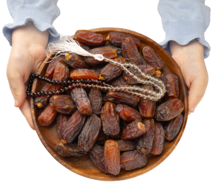 Date fruits and islamic rosary, top view image of child hands holding plate of date fruits and Islamic rosary. Holy month ramadan concept idea image. Isolated transparent png background.