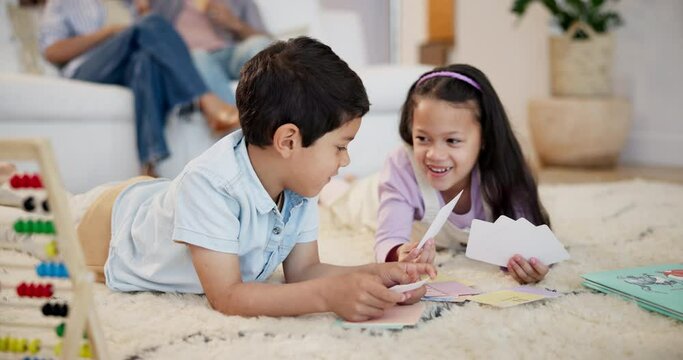 Learning, cards and children siblings on floor for alphabet lesson for language, studying or letter. School, homework or happy kids help with family on mat for teaching education, literacy or phonics
