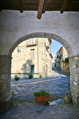 A narrow street between the old houses of Perdifumo, a village in Campania in Italy.
