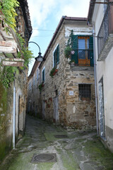 A narrow street between the old houses of Perdifumo, a village in Campania in Italy.
