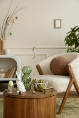 Aesthetic composition of easter living room interior with boucle armchair, round pillow, vase with...