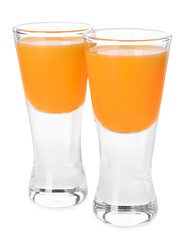 Tasty tangerine liqueur in shot glasses isolated on white